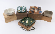 Four assorted Japanese pottery bowls and a pottery lidded box, all in original timber boxes, Meiji and Showa periods, (5 items), the box 9cm high, 20cm wide, 20cm deep