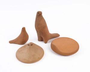 Two terracotta dove statues and two face plaques, (4 items), the largest 27cm high