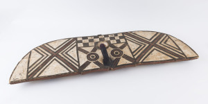 An African tribal headdress, carved wood with earth pigment decoration, Democratic Republic of Congo, ​118cm wide