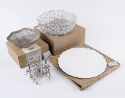 ALESSI candle holder, tray and two baskets, late 20th early 21st century, (4 items), three with original boxes, ​the tray 30cm diameter