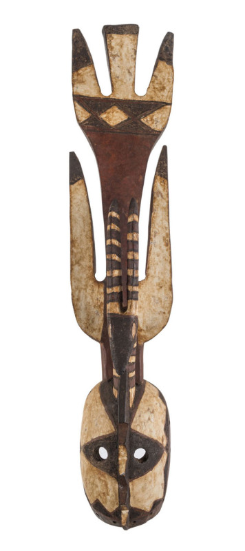 A Mossi tribal mask, carved wood and earth pigments, Burkina Faso, 103cm high