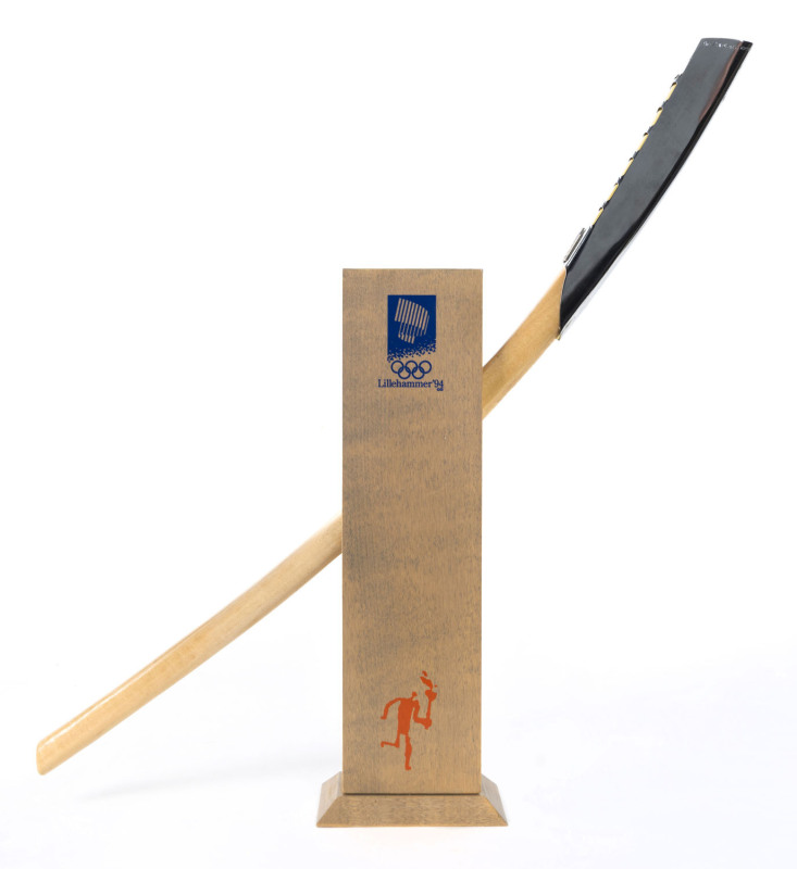 1994 Winter Games Official Torch scaled replica: The burner features the inscription The XVII OLYMPIC WINTER GAMES LILLEHAMMER 1994 and the Games emblem. The sports pictograms appear on the part in copper, while the upper part in aluminium was the recipie