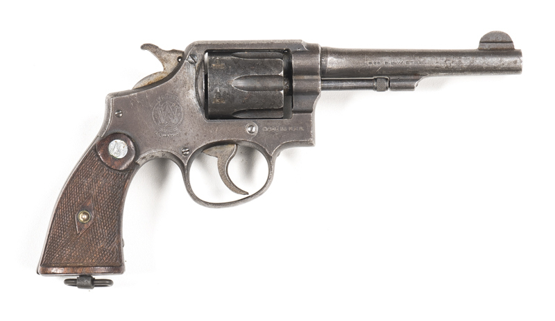 SMITH & WESSON VICTORY MODEL SERVICE REVOLVER: 38 S&W; 6 shot fluted cylinder; 127mm (5") barrel; g. bore; std sights, address & markings; g. profiles & clear markings; patchy grey finish to all metal; g. S&W chequered grips with lanyard loop; gwo & f con