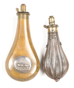 2 FLASKS: rare fluted body S/G flask, PATENT to brass top; JAS EASSON PATENT belt clip fitted; graduated charger & top with spring; g.body & seams with minor dents; 3 hanging rings; 8¼" o/a; Riling pg 284 No.289. JAMES DIXON silver medallion flask of lrg