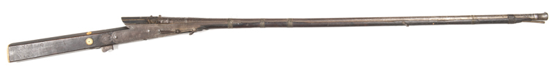 INDIAN MATCHLOCK TORADOR GUN: 58 Cal; 49" rnd barrel secured by 4 fine brass wire & 1 bound leather bands, chiselled flared end to muzzle & in relief foliate design along both sides with relief panels of game bird & floral designs to breech area; mottled