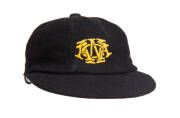 ALLAN EDWARDS' WESTERN AUSTRALIA CRICKET CAP, black, with embroidered "WACA" monogram on front, signed inside by Allan Edwards. Good match-worn condition. [Allan Edwards played 45 matches for WA 1946-57. He played in WA's first Sheffield Shield match in 1