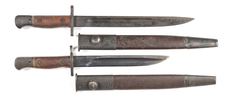 LOT X 2 LITHGOW OWEN GUN BAYONETS: g. 8" blade dated 1944 1/1 MODEL; g. grips & scabbard. Vg 10" blade dated 1945; g. grips & scabbard; both good. N/L
