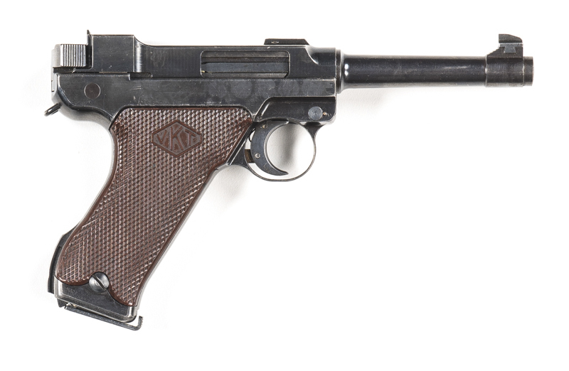 FINLAND LAHTI MODEL L35 S/A PISTOL: 9mm; 8 shot mag; 121mm (4¼") barrel; vg bore; std sights; receiver marked VKT within a diamond surround L.35 SA; sharp profiles & clear markings; retaining 95% original blacked military finish; exc chequered brown plast