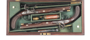 FINE CASED PR OF FULL STOCKED FLINTLOCK DUELLING PISTOLS by MC CORMICK: 28 bore; 10" octagonal swamped barrels; MC CORMICK BELFAST engraved to top flat; AD 1791 49 marked under barrels; silver dovetail front sights, notched rear sights; gold bands to bree