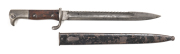 GERMAN MODEL 1898 MAUSER BAYONET with sawback: g. 9 7/8" blade; ricasso marked with Imperial cypher & AMBERG; small Imperial cypher W.14 to back edge; g. wooden grips with even wear; g. hilt with eagle pommel; complete with steel scabbard; g. cond.