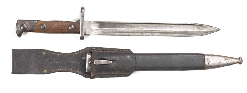 GERMAN MODEL 71/84 MAUSER BAYONET: vg blade with long fullers; SOEMMERDA to ricasso; 38.R.6.222 to cross guard; g. wooden grips with minor marks; g. hilt; complete with g. steel mounted leather scabbard & frog; g. cond.