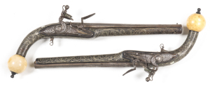 MATCHED PR, FULL STOCKED ALBANIAN STYLE FLINTLOCK HOLSTER PISTOLS: 18 bores; 10¾" chisel engraved barrels with Coptic cross inlaid in gold to both barrels & MOP inlays to the breech; p. bores; chisel engraved banana shaped locks with scroll work decoratio