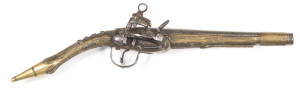 ALBANIAN FULL STOCKED RAT TAIL MIQUELET HOLSTER PISTOL OF ALL METAL CONSTRUCTION: 20 Bore; 8¾" barrel; p. bore; plain miquelet lock, cock & frizzen showing wear; plain iron barrel & t/guard; ornate brass stock of traditional form with foliate panels to fo