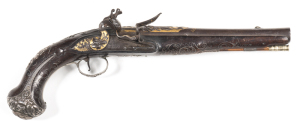 EXEPTIONAL SILVER MOUNTED FULL STOCKED FLINTLOCK HOLSTER PISTOL by WILSON OF LONDON, made for the Eastern Market: 16 bore; 9½" swamped barrel, chisel engraved with trophies & flags with a gold wash back ground & gold inscribed LONDON: p. bore; curved lock