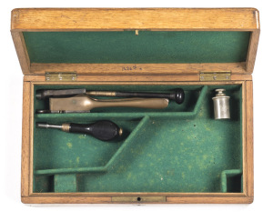 ENGLISH OAK PISTOL CASE: partitioned & lined in green baize with a vg 120 bore Adams brass mould, nipple wrench, rammer, wad punch & pewter oil bottle’ all g cond.