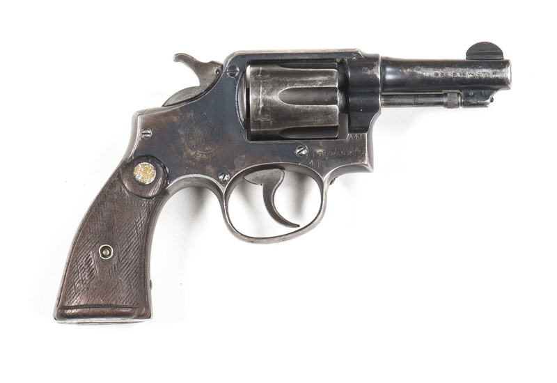 SMITH & WESSON VICTORY MODEL REVOLVER: 38 S&W; 6 shot cylinder; 80mm (3 1/8") barrel; g. bore; std sights; wear to profiles, Trade mark, address & military markings; 65% blue remains; f. S&W grips with considerable wear; gwo & f. cond. #782161 Circa 1942