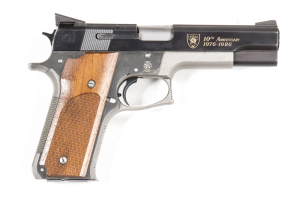 SMITH & WESSON MODEL 745 10TH ANNIVERSARY I.P.S.C. 1976-1986 PISTOL: 45 ACP; 8 shot mag; 127mm (5") barrel; g. bore; std sights; S&W address to lhs of slide; 2 tone matt & polished finish to slide; 2 tone stainless steel frame with S&W Trade mark; sharp p