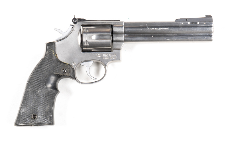 SMITH & WESSON MODEL 686 DISTINGUISHED COMBAT C/F STAINLESS STEEL C/F REVOLVER: 357 Magnum; 6 shot fluted cylinder; 150mm (5 7/8") barrel; g. bore; adjustable front & rear sights; S&W Trade mark to lhs of frame, address to rhs; sharp profiles & clear mark
