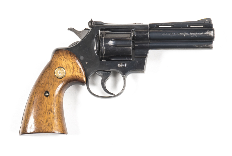 COLT PYTHON C/F REVOLVER: 357 Magnum; 6 shot fluted cylinder; 102mm (4") barrel; g. bore; std sights; address to lhs of barrel; Cal markings to lhs of frame; g profiles & clear markings; 85% original blue finish remains with most losses to muzzle & lhs of