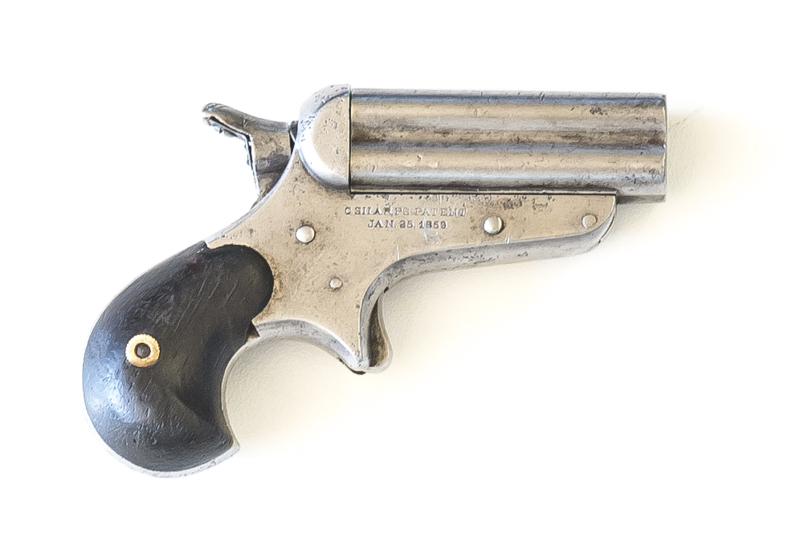 U.S. SHARPS MODEL 4, 4 BARREL DERRINGER: 32 long RF; 63mm (2½") barrel cluster; f. bores; std sight; C. SHARPS PATENT JAN 25 1859 to rhs of frame; fitted with bird's head grip & spur trigger; slight wear to profiles & clear markings; silver grey finish to