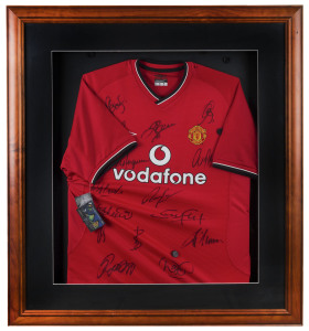 MANCHESTER UNITED: team jersey signed by members of the 2000/01 Premiership winning team, their third successive Premiership, with most of the signatories playing in all three of the successful premiership squads, comprising Jonathan Greening, Teddy Sheringham, Paul Scholes, David Beckham, Alex Ferguson, Gary & Phil Neville, Roy Keane, Andy Cole, Dwight Yorke, Ole Solksjaer, Dennis Irwin, Fabien Barthez, Ryan Giggs & David May; framed & glazed with CofA, 91x101cm overall.