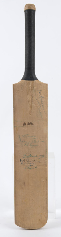 A mini-bat (50cm) signed to reverse of the blade by the Australian and English teams of 1956 (some faded); also signed on the front by Don Bradman, Jack Hobbs, Denis Compton, Freddie Brown, George Duckworth and others.Provenance: The estate of A.E.James,