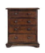 An Australian apprentice chest, stained red pine, circa 1900, top to drawers fitted with compartments, 35.5cm high, 29cm wide, 19cm deep. PROVENANCE: The Rodney Pemberton Collection - 2