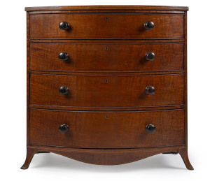 A fine English Regency four drawer bow fronted chest with splay legs, mahogany with string inlay, cross-banding and cock beading, circa 1820, 110cm high, 113cm wide, 62cm deep