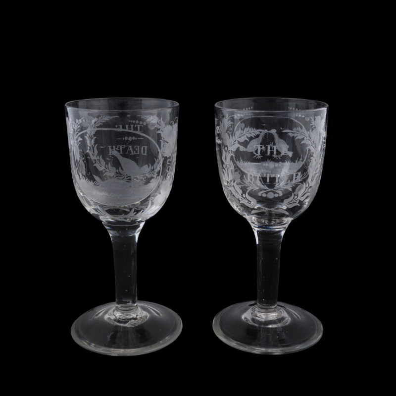 A fine pair of English wine glasses engraved with cock fighting scenes titled "THE BATTLE" and "THE DEATH", late 18th early 19th century, ​17.5cm high