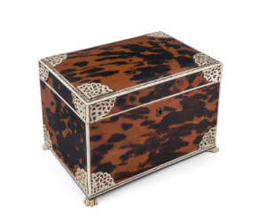 An Anglo-Indian jewellery casket, tortoiseshell, bone and ivory with silver escutcheon, early 19th century, sandalwood interior with mirror inside the lid, plus key, 13cm high, 18cm wide, 12.5cm deep