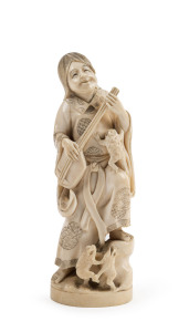 Japanese carved ivory figure of a musician and frogs, Meiji period, early 20th century, two character mark to base, 19.5cm high