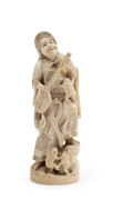 Japanese carved ivory figure of a musician and frogs, Meiji period, early 20th century, two character mark to base, ​19.5cm high