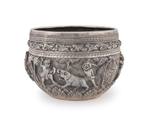 A Burmese silver bowl with repousse decorated frieze, circa 1900, engraved elephant to base, 10.5cm high, 15cm diameter, 350 grams
