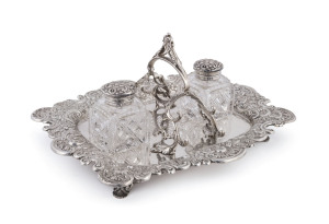 An English sterling silver inkstand desk set with inscription "Presented To John Brewer Esq. By The Committee And Friends Of The Dawlish Cottage Hospital In Greatful Recognition Of More Than 20 Years Of Unwearied Labour And Kindness, In Connection With The Institution. June 1895.". Made by Henry Wigfull of Sheffeild, circa 1894. Original crystal ink bottles with matching sterling silver hallmarks. the tray 31cm wide, 1110 grams
