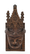 A Gothic offertory carved oak wall mounted box, 18th century, ​26cm high