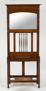 An English hallstand, oak with brass pegs, early 20th century, 190cm high, 84cm wide, 30cm deep