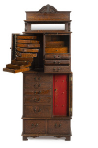 An antique dentist's cabinet, American, solid oak with maple and pine secondary timbers, made by "The American Cabinet Co.", late 19th century, 188cm high, 69cm wide, 38cm deep