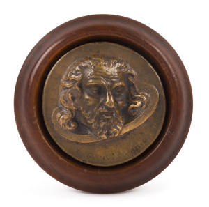 An Italian bronze portrait plaque in timber surround, 19th century, the plaque 7.5cm diameter, the mount 10.5cm diameter