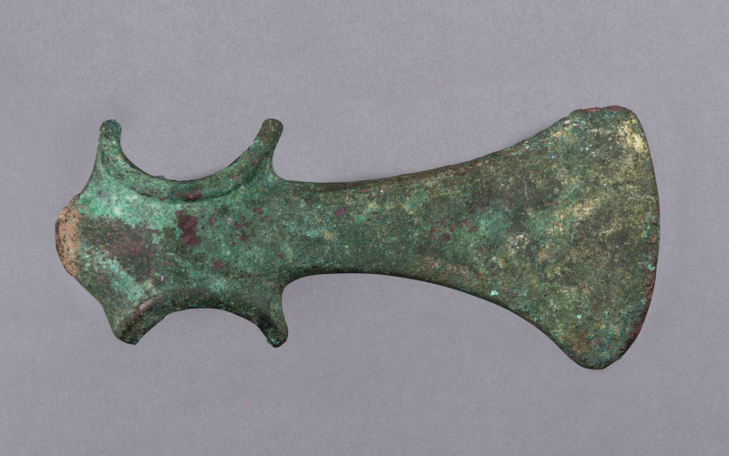A bronze age axe head, unknown origin, circa 1200 B.C. 14.5cm long. PROVENANCE: Christie's London, November 21st, 1978, formerly the Harold Peterson Collection.