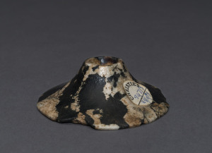 An Egyptian mottled granite stone mace head, Naqada I, circa 3500 B.C. 2.5cm high, 7.5cm wide. PROVENANCE: The Josef Mueller Collection, Christie's London, November, 1979.