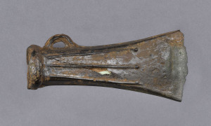 Celtic bronze age axe head with raised fluted decoration, circa 3000 B.C. 10.5cm long