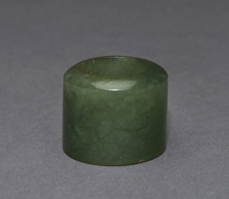 A Chinese celadon jade archers ring, Qing Dynasty, circa 1700, ​3cm high, 3.5cm diameter