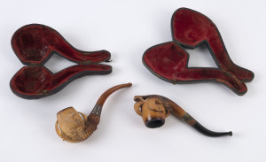 Two eagles claw pipes, carved meerschaum, amber and silver in leather cases, 19th century, ​13cm and 14cm long