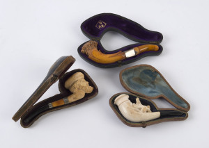 Three assorted carved meerschaum pipes in fitted cases, 19th century, ​the largest 11cm long