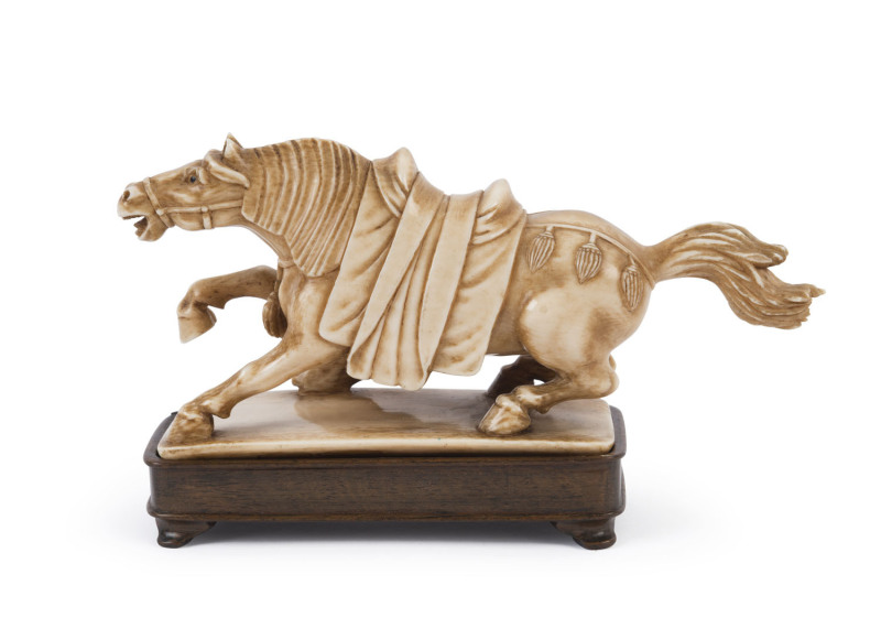 A Chinese horse statue, carved ivory and carved wooden stand, 19th century, ​16.5cm long