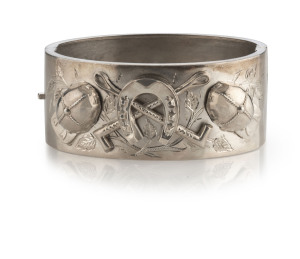 An antique English sterling silver bangle with jockey motif, 19th century, 6cm wide, 35 grams