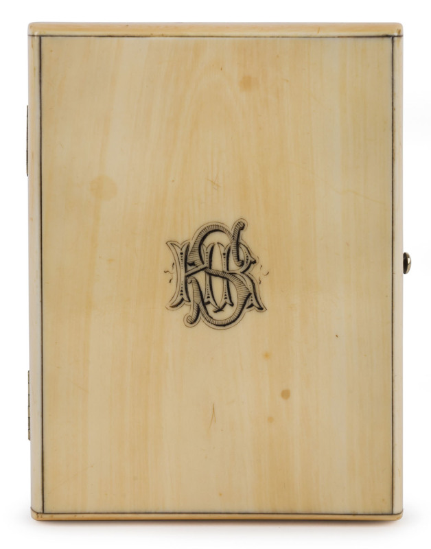 A fine ivory card case with engraved monogram "H.S.R.", interior fitted with blue silk accordion compartments, 19th century, ​11cm high