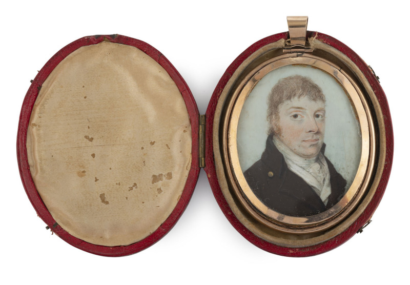 A Regency miniature portrait of a gent in rose gold frame with blue enamel back and hair display with "V.B." monogram, circa 1820, housed in original red leather case with silk lining, ​9cm high overall