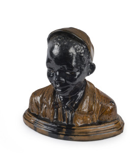 An Austrian pottery bust of an African boy, circa 1900, 35cm high, 36cm wide, 20cm deep