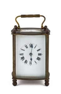 A French carriage clock with Roman numerals in brass case, early 20th century, stamped "Made In France", 14cm high